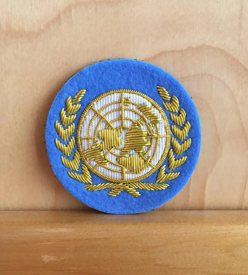 United Nations Officer Hat Badge – Polished Metal 1